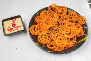 "Close-up of Indian spices in colorful bowls on a wooden table"